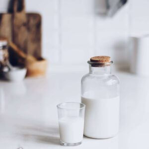 A jar and glass of milk