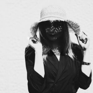 Lady being shaded by her hat